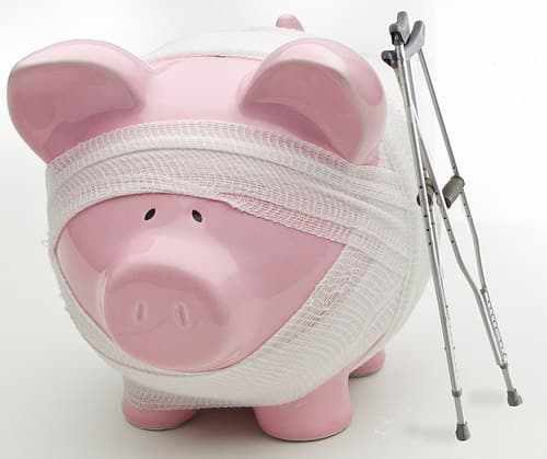 Injured Piggy Bank With Crutches by kenteegardin bank account photo